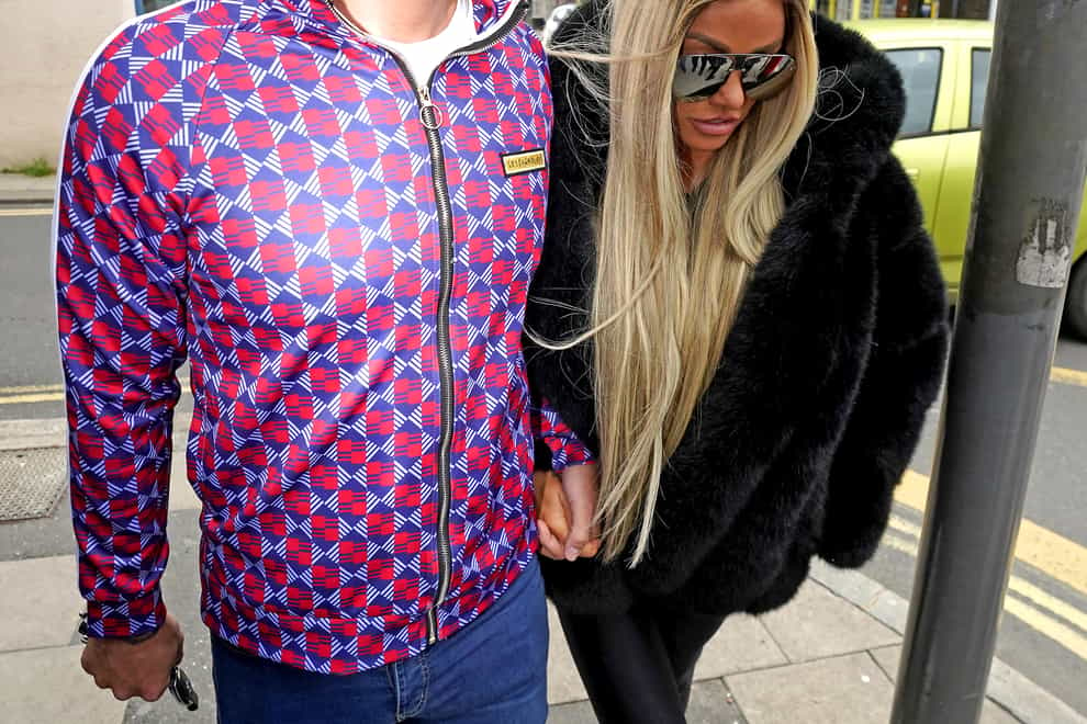 Katie Price alongside fiancee Carl Woods arrives at Lewes Crown Court, West Sussex, where she is appearing on charges of breaching a restraining order. Picture date: Wednesday May 25, 2022 (Steve Parsons/PA)