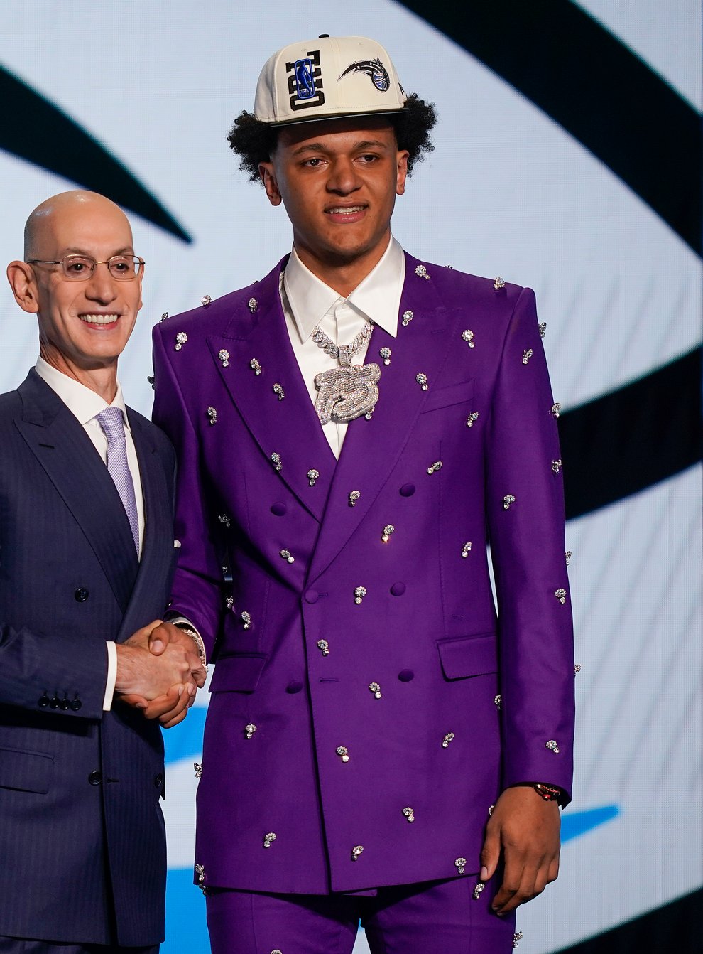 Paolo Banchero, right, with NBA commissioner Adam Silver after being selected as the number one pick overall by the Orlando Magic in the NBA Draft (John Minchillo/AP/PA)