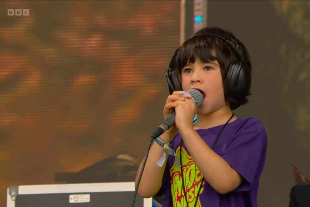 Buddy, the son of guitarist Liam Finn and grandson of frontman Neil Finn, sang along to his family’s music on the Pyramid Stage at Glastonbury (BBC/PA)