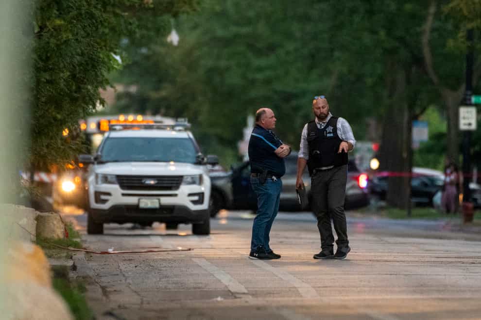 Police at the scene where a five-month-old girl was shot and killed in the South Shore neighbourhood of Chicago (Tyler Pasciak LaRiviere/Chicago Sun-Times via AP)