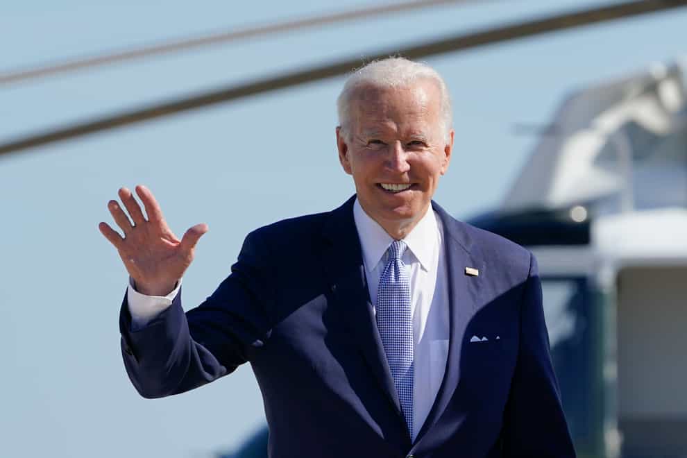 President Joe Biden waves to the media as he walks to board Air Force One at Andrews Air Force Base, Maryland (Susan Walsh/AP)