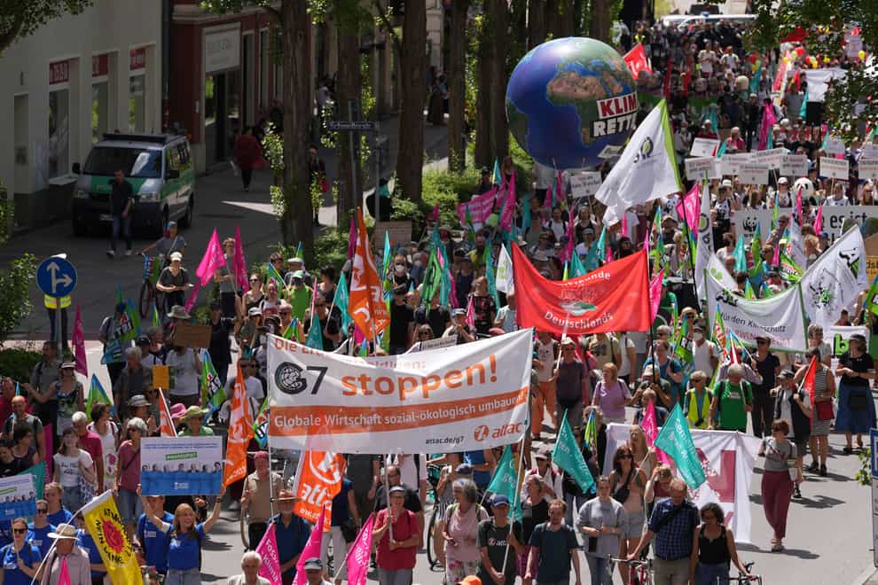 Climate activists march through Munich ahead of the G7 meeting in Germany (Matthias Schrader/AP)