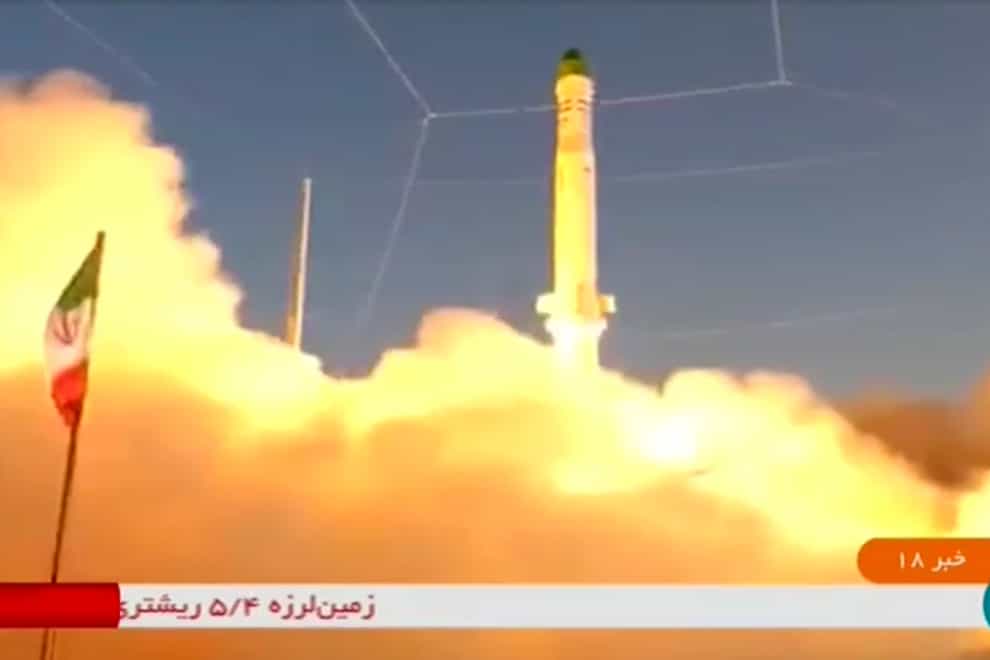 An Iranian satellite-carrier rocket, called Zuljanah, blasts off from an undisclosed location in Iran (IRINN via AP)