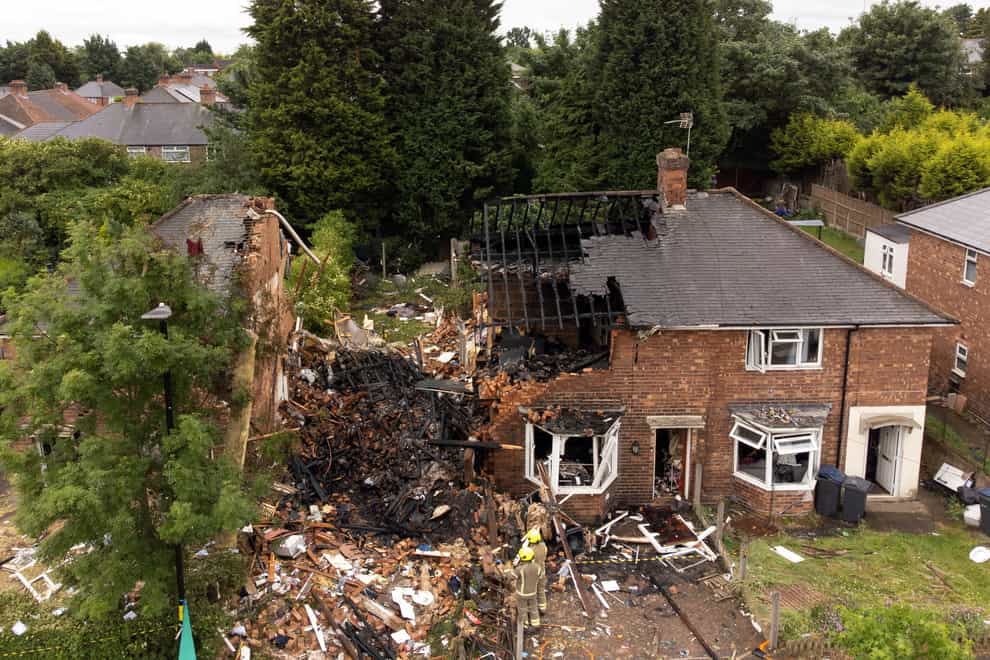 Emergency services at the scene in Dulwich Road, Kingstanding, in Birmingham, where a woman has been found dead after a house was destroyed in a gas explosion. One man rescued from the wreckage remains in hospital in a life-threatening condition. Picture date: Monday June 27, 2022.