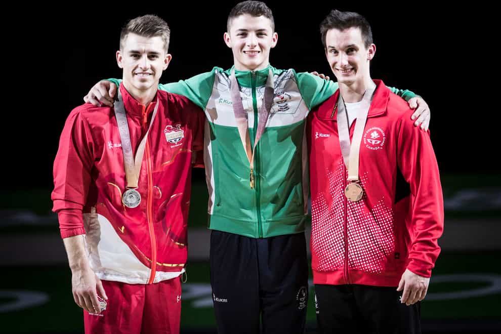 Rhys McClenaghan (centre) shocked Max Whitlock on the Gold Coast (Danny Lawson/PA)