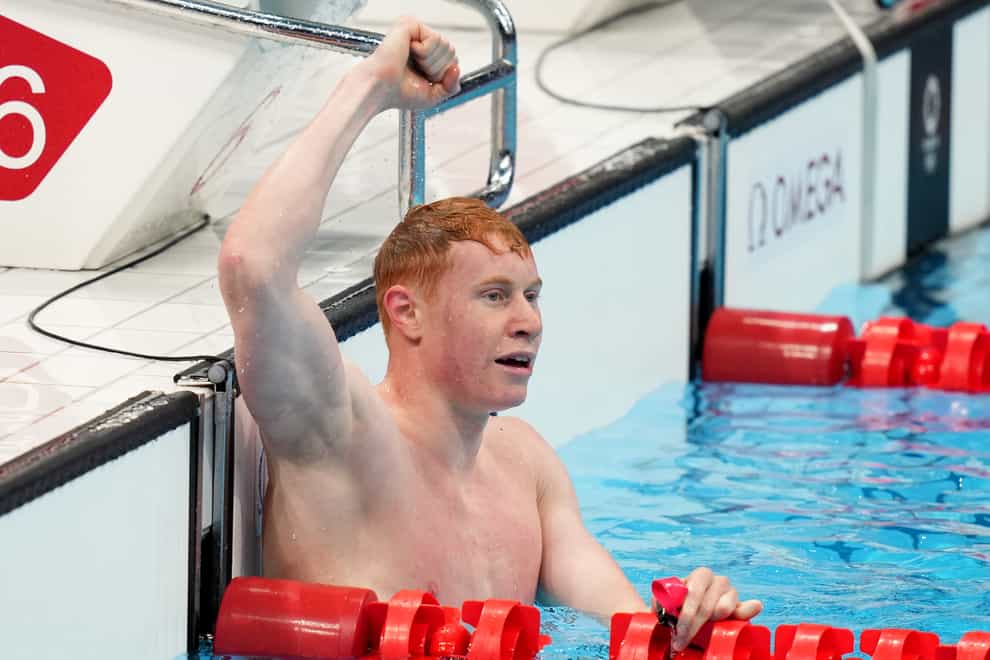 Tom Dean celebrates his victory in the Olympic 200m freestyle final in Tokyo (Joe Giddens/PA)