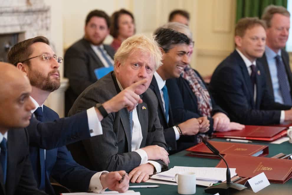 Prime Minister Boris Johnson looks on as Cabinet Secretary, Simon Case, gestures at a Cabinet meeting at 10 Downing Street, London. Mr Case appeared before a parliamentary committee on Tuesday (Carl Court/PA)