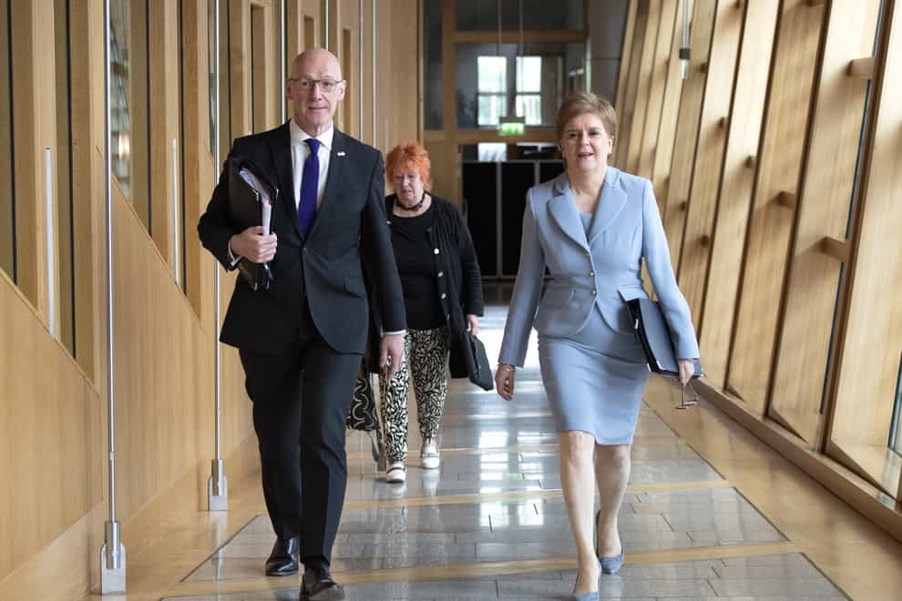 First Minister Nicola Sturgeon (right) on her way to the Chamber to deliver a statement to MSPs in the Scottish Parliament, Edinburgh, on her plans to hold a second referendum on Scottish independence on October 19, 2023. (Lesley Martin/PA)