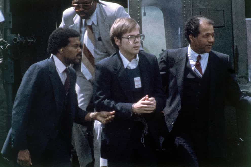 John Hinckley Jr in custody in 1981 after the shooting (AP)