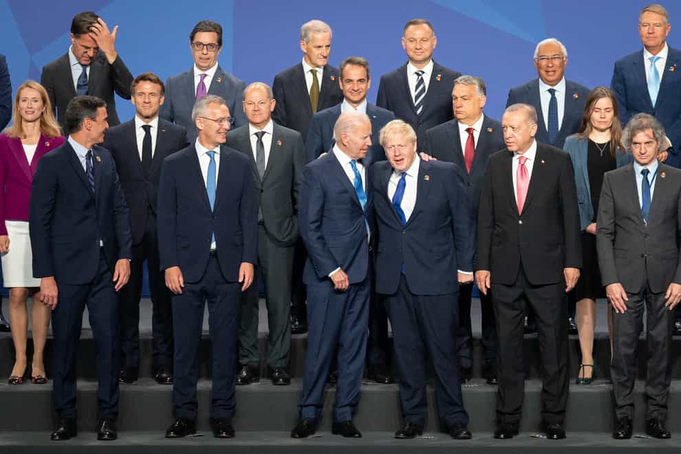 Prime Minister Boris Johnson stands beside US President Joe Biden and other world leaders posing for a family photo during the Nato summit in Madrid, Spain (Stefan Rousseau/PA)