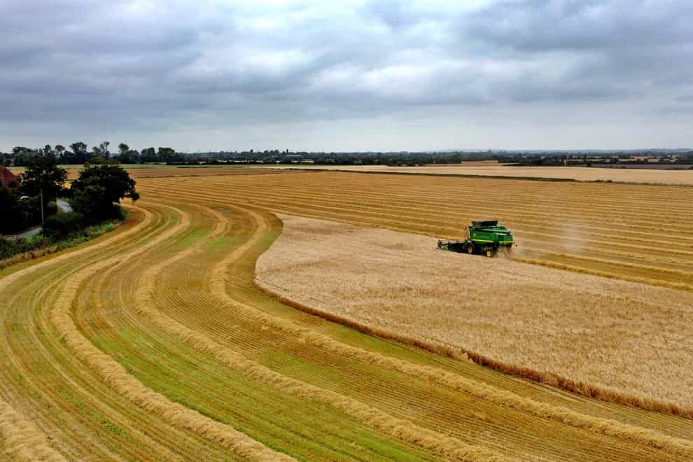 A combine harvester in operation (Gareth Fuller/PA)