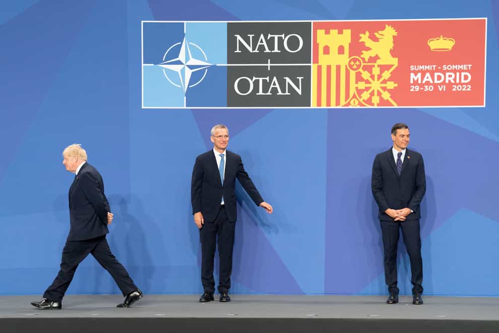 Nato secretary general Jens Stoltenberg, and Spanish prime minister Pedro Sanchez welcome Prime Minister Boris Johnson to the Nato summit in Madrid, Spain (Stefan Rousseau/PA)