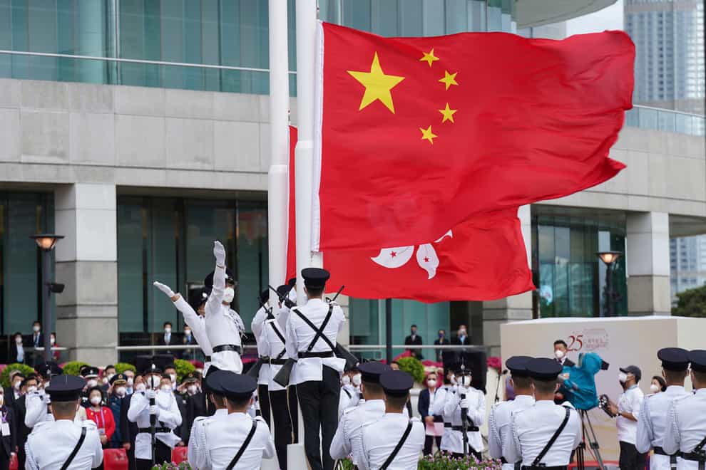 Hong Kong’s incoming and outgoing leaders have attended a flag-raising ceremony marking the 25th anniversary of the return to Chinese rule for the city pulled in recent years under much tighter Communist Party control (Magnum Chan, Pool/AP)