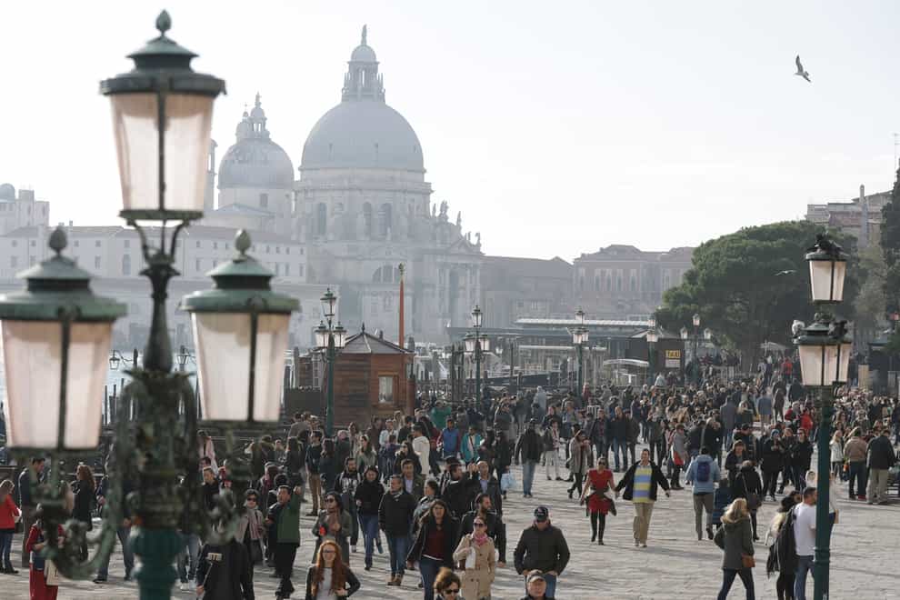Tourists stroll in Venice (AP)