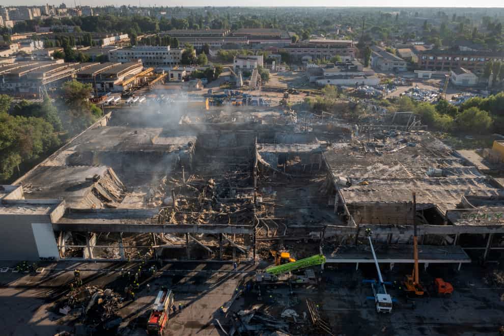 A shopping centre burns after a rocket attack in Kremenchuk (Efrem Lukatsky/AP)