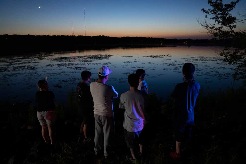 Friends and family gathered at Vadnais Lake after news of a dead child being pulled out of the lake broke (Alex Kormann/Star Tribune/AP)