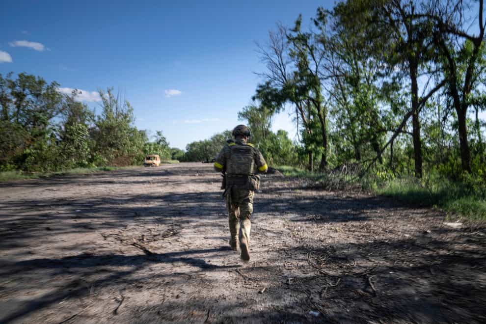 A Ukrainian serviceman at the front line near Kharkiv (Evgeniy Maloletka/AP)