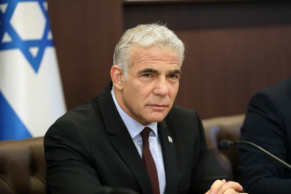 Israel’s caretaker prime minister Yair Lapid chairs his first Cabinet meeting in Jerusalem (Gil Cohen-Magen/Pool/AP)