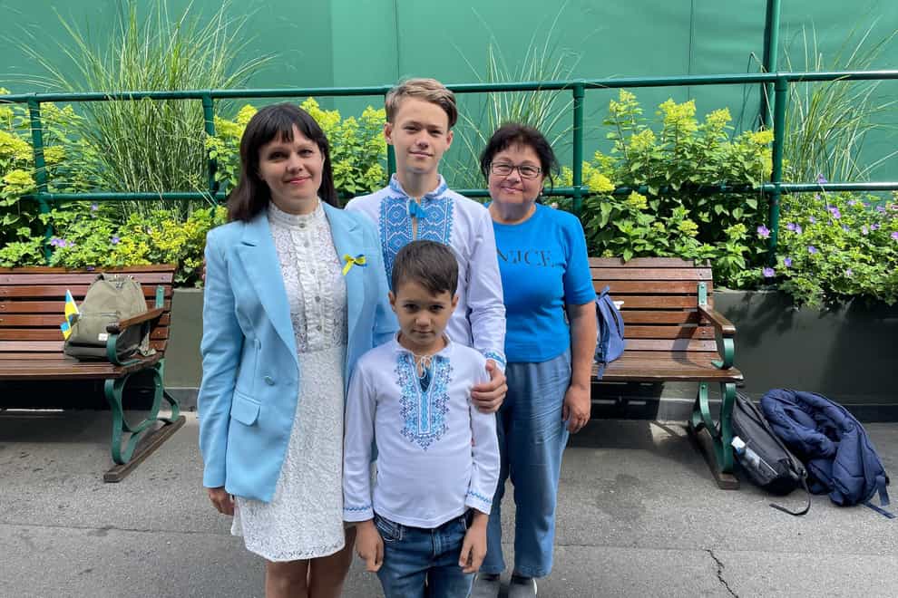 Ukrianian refugees Kateryna Sokol, left, with her mother Zinaida and sons Ivan and Anton at Wimbledon (Laura Parnaby/PA)