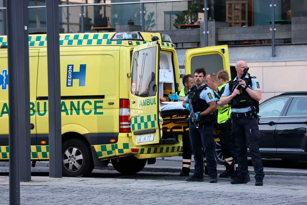An ambulance and armed police outside the Field’s shopping centre, in Orestad, Copenhagen (Olafur Steinar Gestsson /Ritzau Scanpix via AP)