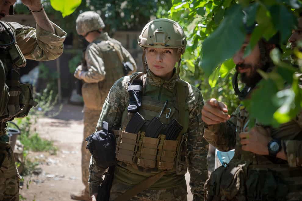 Ukrainian platoon commander Mariia talks to her soldiers in their position in the Donetsk region, Ukraine (Efrem Lukatsky/AP)