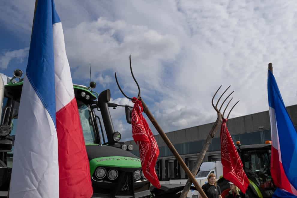Tractors were used to blockade a distribution centre for a supermarket chain just north of Amsterdam (Peter Dejong/AP)