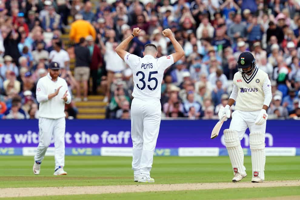 England’s Matthew Potts celebrates the wicket of India’s Shardul Thakur (PA)