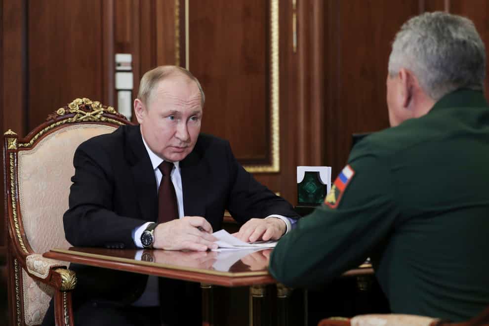 Vladimir Putin listens to Russian defence minister Sergei Shoigu’s report (Mikhail Klimentyev, Sputnik, Kremlin Pool Photo via AP)