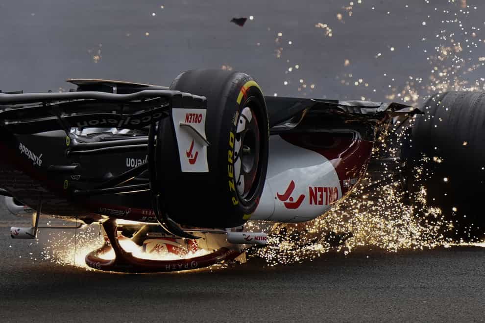 Alfa Romeo’s Zhou Guanyu slides towards the barrier after a collision at the start of the British Grand Prix (Tim Goode/PA)