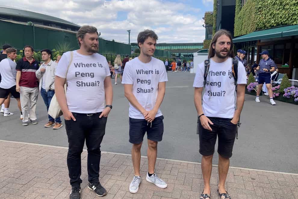 Protesters (left to right) Will Hoyles, 39, Caleb Compton, 27, and Jason Leith, 34, who all work for Free Tibet who have come to Wimbledon to draw attention to Peng Shuai (Rebecca Speare-Cole/PA)