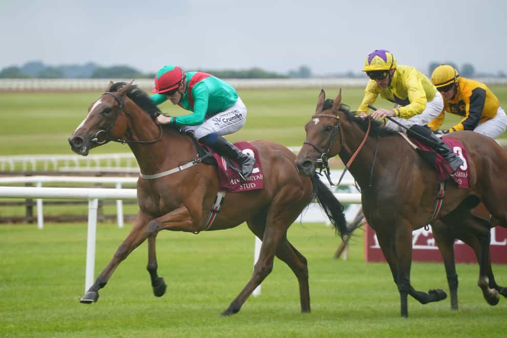 La Petite Coco (left) ridden by jockey William Lee on their way to winning the Alwasmiyah Pretty Polly Stakes during day three of the Dubai Duty Free Irish Derby Festival at Curragh Racecourse in County Kildare, Ireland (Niall Carson/PA)