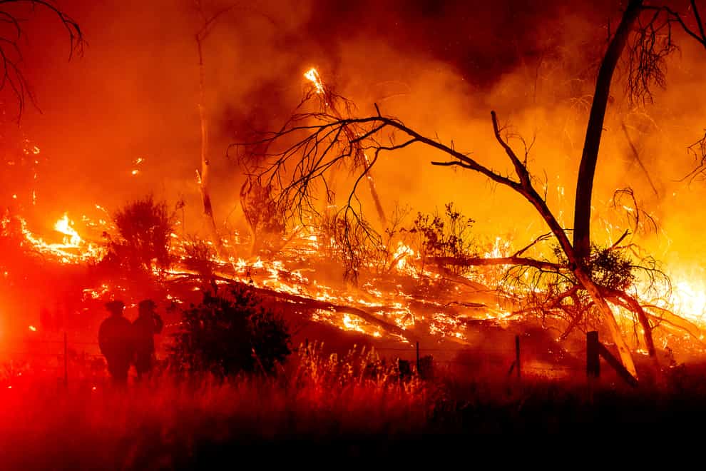 Firefighters battle the Electra Fire in the Rich Gulch community of Calaveras County, California (AP)