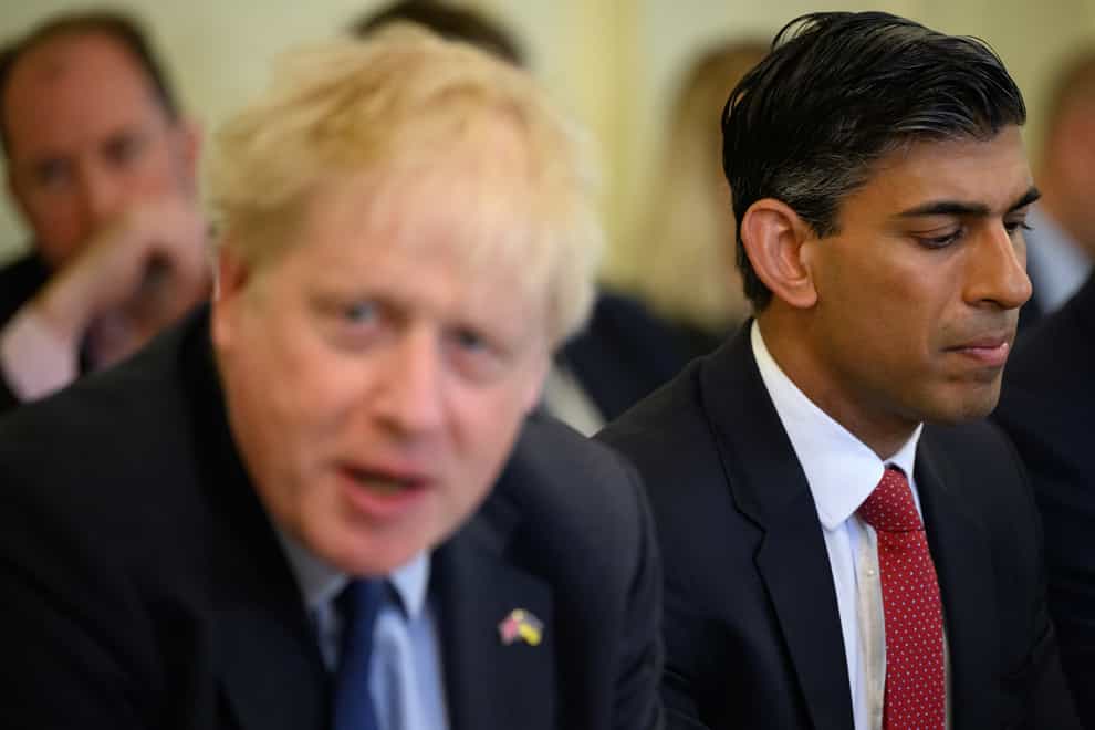 Former chancellor of the Exchequer Rishi Sunak alongside Prime Minister Boris Johnson (Leo Neal/PA)