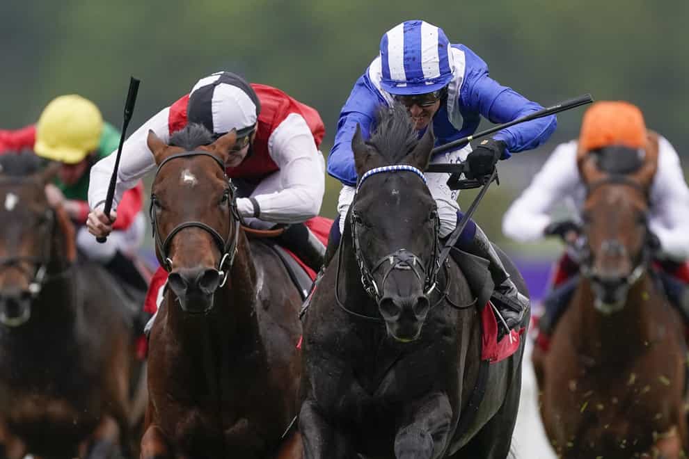 Mostahdaf (right, blue and white) runs at Newmarket (Alan Crowhurst/)