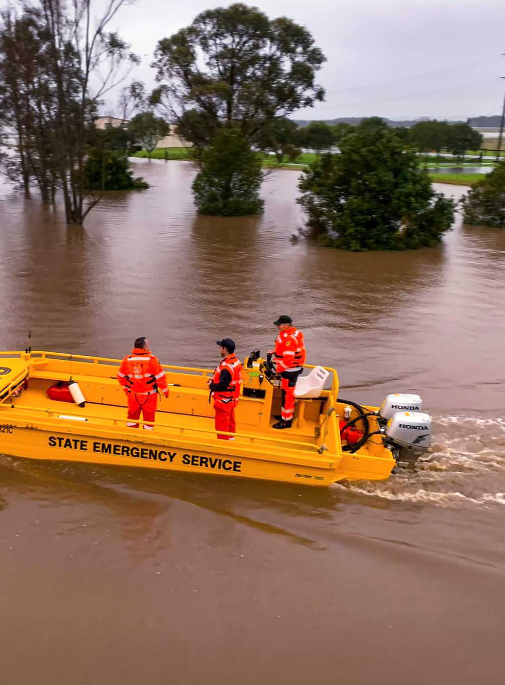 A boat patrols the Hunter River near Hinton, Australia (State Emergency Service via AP)