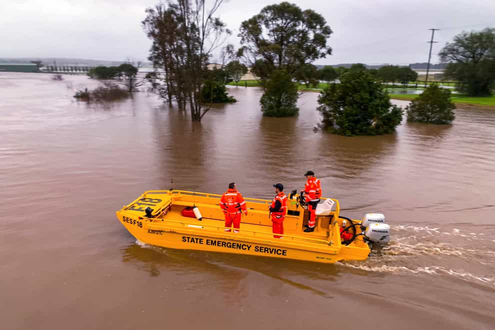 A boat patrols the Hunter River near Hinton, Australia (State Emergency Service via AP)