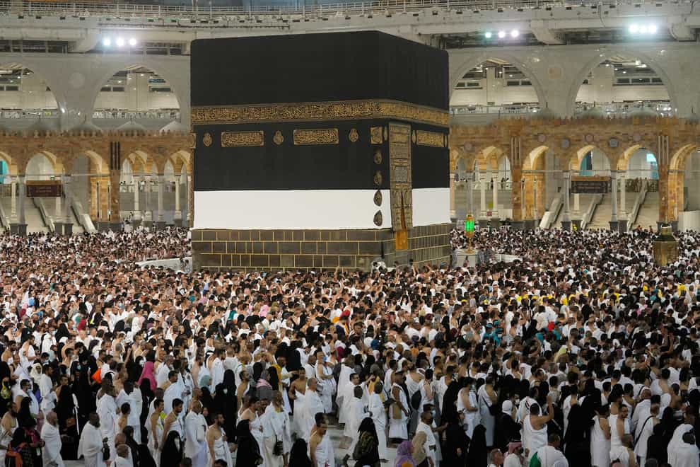 Pilgrims circle around the Kaaba at the Grand Mosque in Mecca (Amr Nabil/AP)
