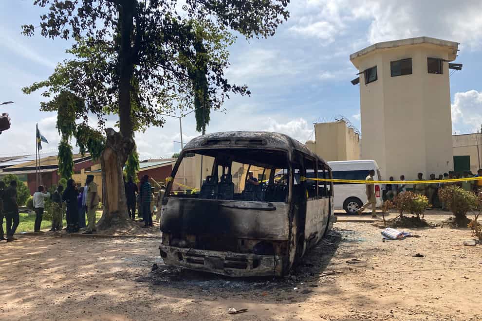 A burned-out bus outside the prison in Kuje (Chinedu Asadu/AP)