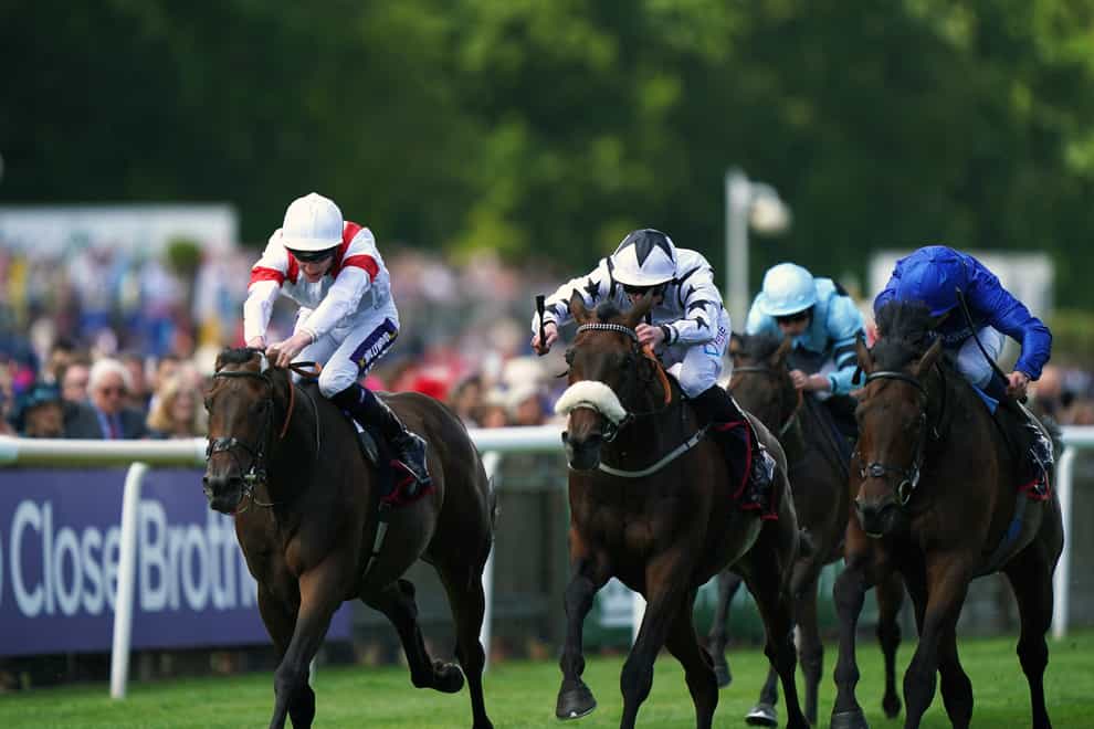 Deauville Legend ridden by Daniel Muscutt (left) on the way to winning the Bahrain Trophy Stakes on Ladies day of the Moet and Chandon July Festival at Newmarket racecourse (Tim Goode/PA)