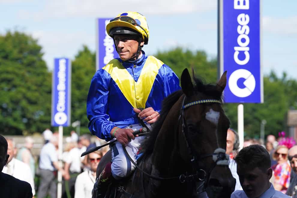 Frankie Dettori celebrates winning the Edmondson Hall Solicitors Sir Henry Cecil Stakes riding Mighty Ulysses on Ladies day of the Moet and Chandon July Festival at Newmarket racecourse, Suffolk. Picture date: Thursday July 7, 2022.