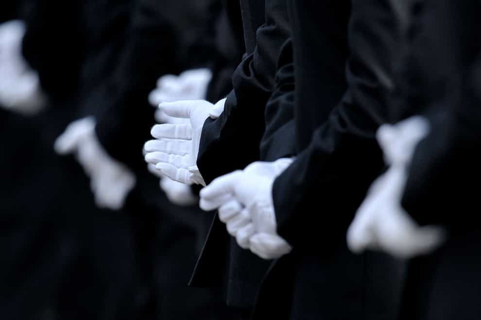 Metropolitan Police officers wearing white dress uniform gloves during a Metropolitan Police passing out parade for new officers at Peel House in Hendon (Nick Ansell/PA)