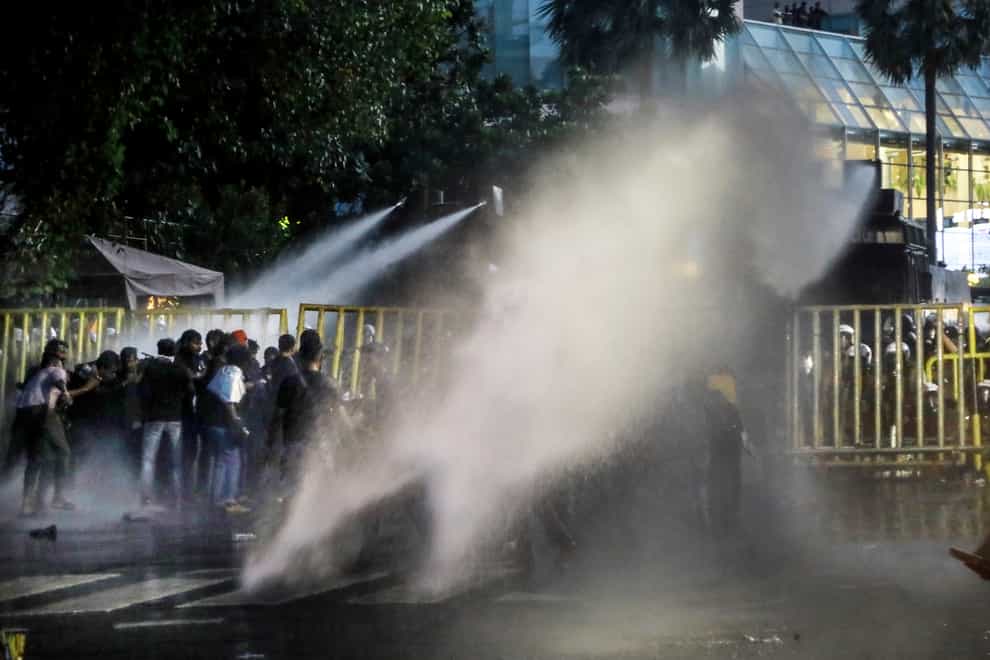 Police use water canon to disperse protesters in Colombo, Sri Lanka (Amitha Thennakoon/AP)