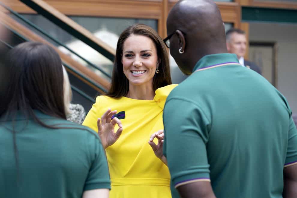 The Duchess of Cambridge meets Wimbledon staff Rachel Williams and Dave Tulloch (PA)