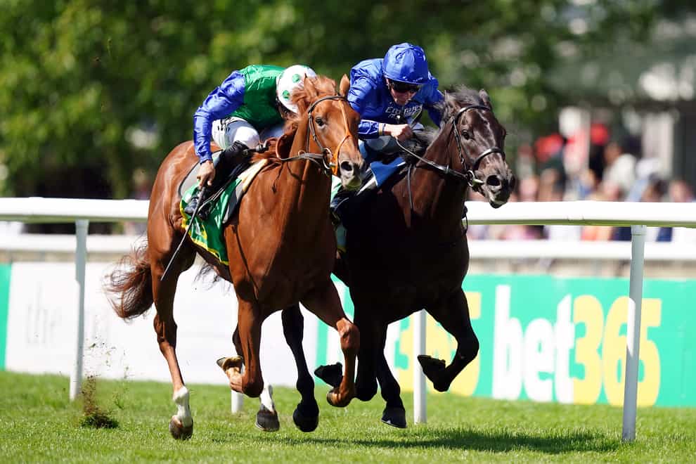 Isaac Shelby ridden by jockey Sean Levey (left) on their way to winning the bet365 Superlative Stakes ahead of Victory Dance and William Buick (right) on Darley July Cup Day of the Moet and Chandon July Festival at Newmarket racecourse (Mike Egerton/PA)