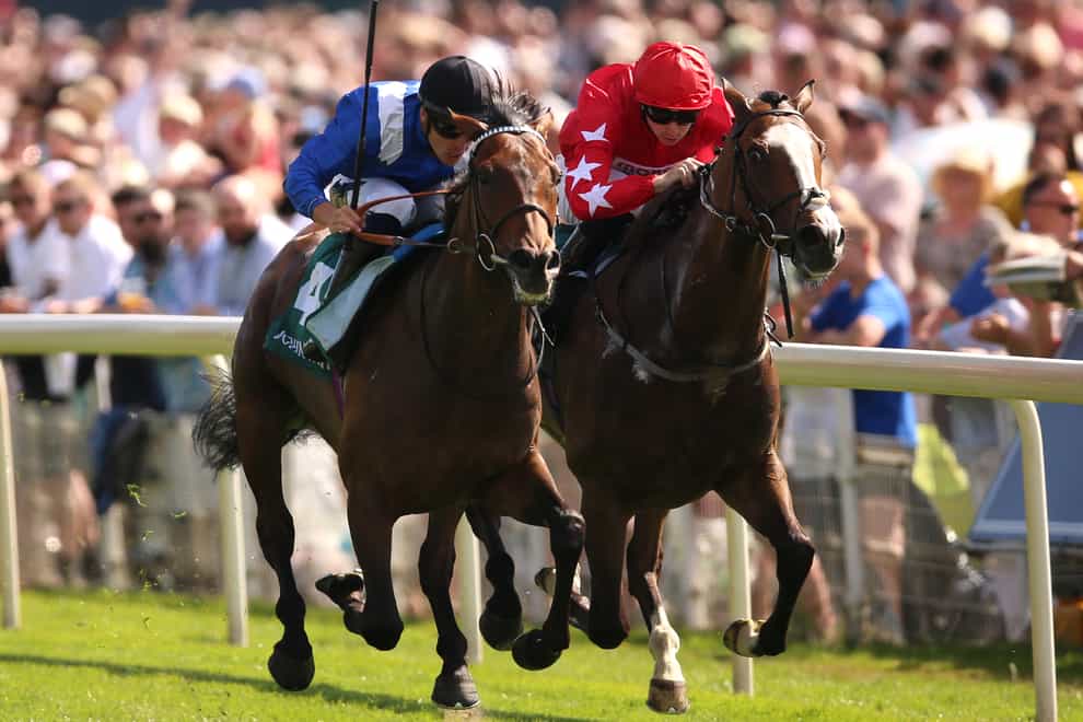 Anmaat (left) ridden by Kevin Stott wins The John Smith�s Cup during John Smith’s Cup Day at York racecourse. Picture date: Saturday July 9, 2022.
