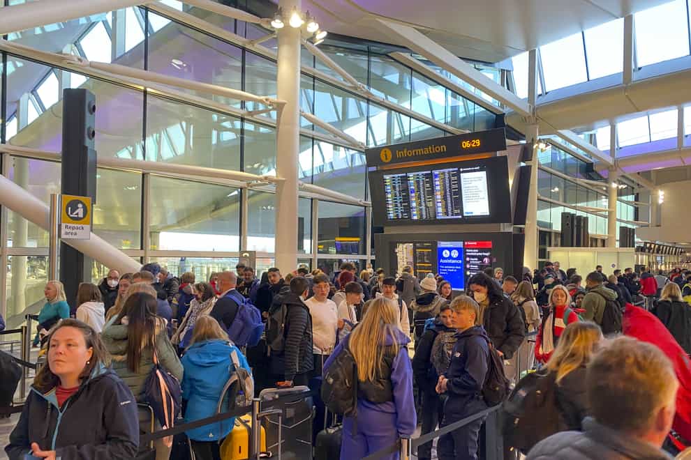 Passengers check-in in terminal 2 at Heathrow Airport, west London as the getaway starts in earnest (Steve Parsons/PA)