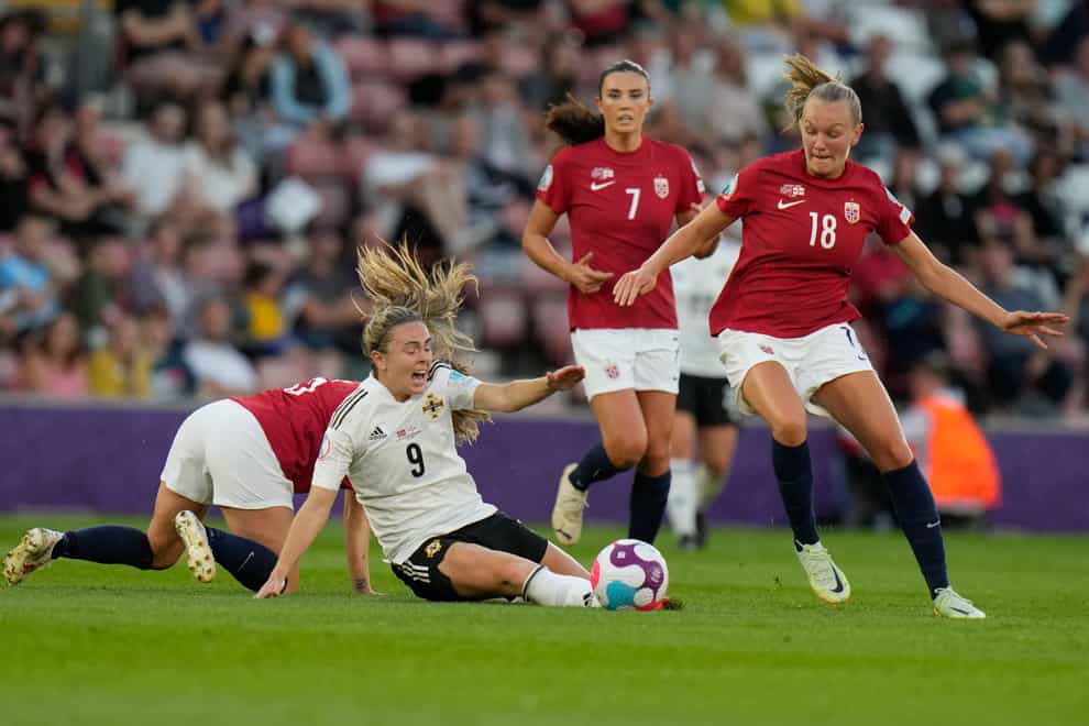 Northern Ireland’s Simone Magill, center, is fouled by Norway’s Maren Mjelde during the Women Euro 2022 soccer match between Norway and Northern Ireland, at the St.Mary’s stadium, in Southampton, Thursday, July 7, 2022. (AP Photo/Alessandra Tarantino)