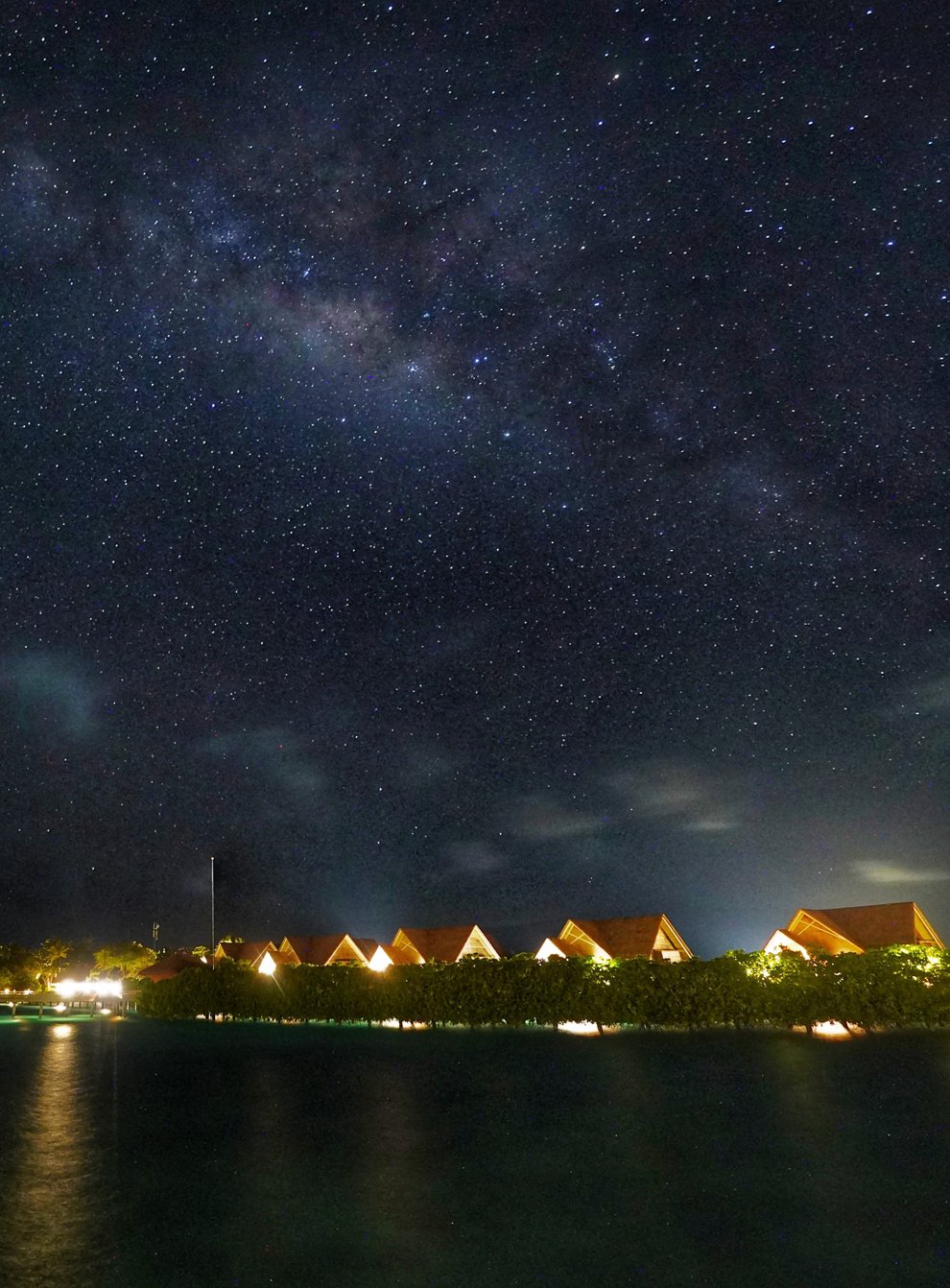 The Milky Way pictured above the lights of Milaidhoo island at night (Owen Humphries/PA)