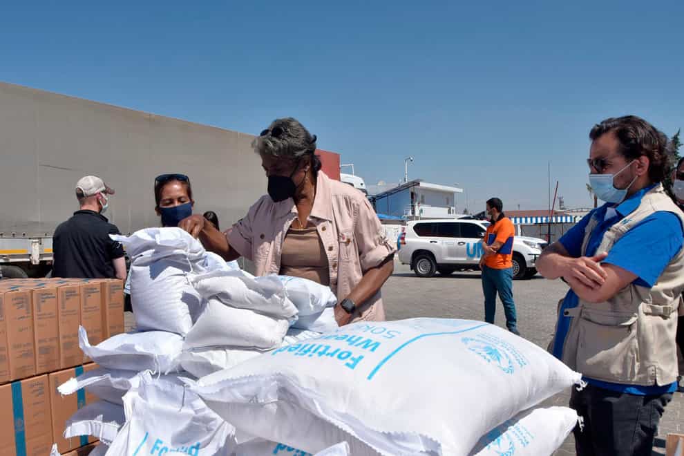 Linda Thomas-Greenfield, US ambassador to the United Nations, examines aid materials at the Bab al-Hawa border crossing between Turkey and Syria (US Embassy in Turkey/AP)