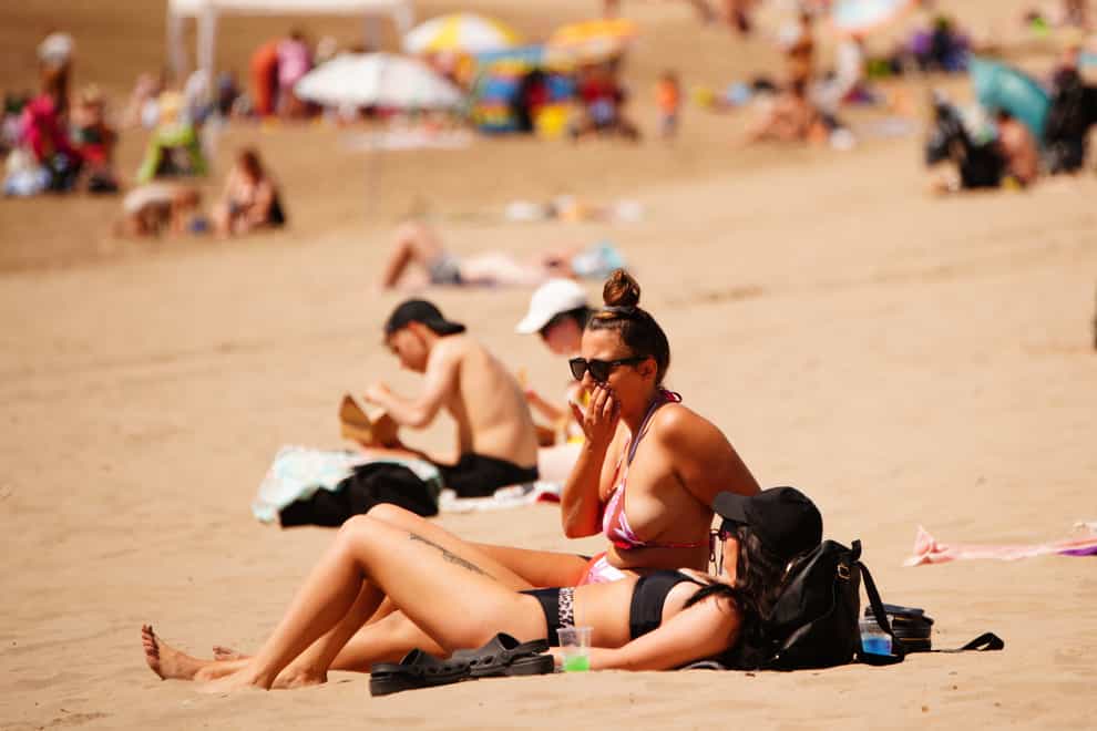 Symptoms of heat exhaustion can include nausea and rapid breathing (Ben Birchall/PA)